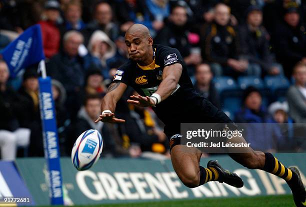 Wasps' Tom Varndell dives for the ball during the Amlin Challenge Cup match between London Wasps and Racing Metro 92 at the Causeway Stadium. On...