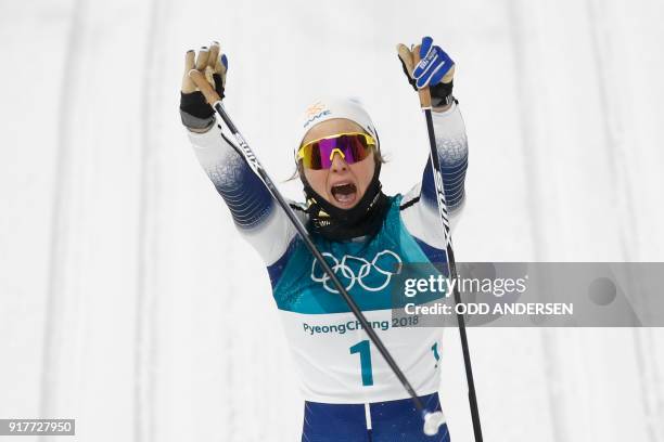 Sweden's Stina Nilsson crosses the finish line to win gold in the women's cross-country individual sprint classic final at the Alpensia cross country...