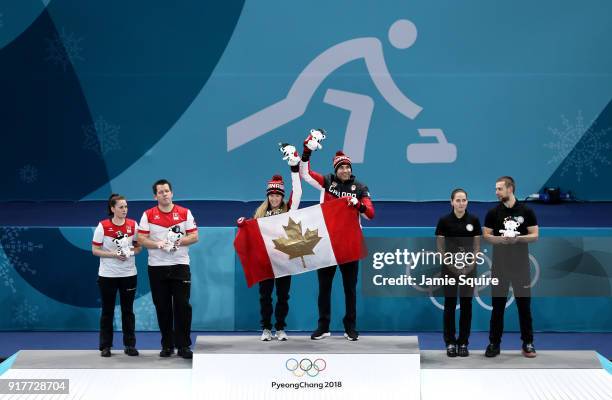 Silver medal winners Jenny Perret and Martin Rios of Switzerland, Gold medal winners Kaitlyn Lawes and John Morris of Canada, and Anastasia...