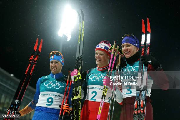 Silver medalist Federico Pellegrino, gold medalist Johannes Hoesflot Klaebo of Norway and Alexander Bolshunov of Olympic Athlete from Russia...