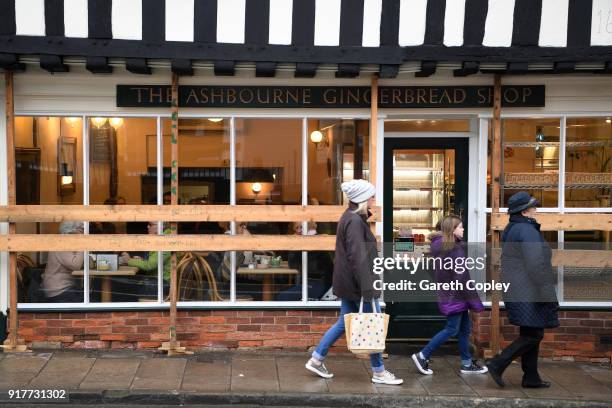 Shop fronts board their windows in preparation for the start of the Shrovtide Football match where rival teams 'Up'ards' and 'Down'ards' battle for...