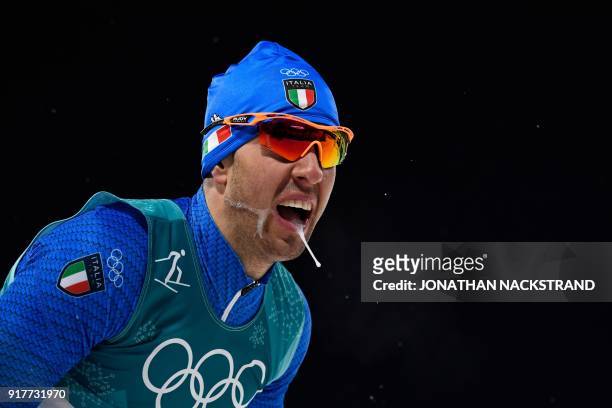 Italy's Federico Pellegrino crosses the finish line to win silver in the men's cross-country individual sprint classic final at the Alpensia cross...