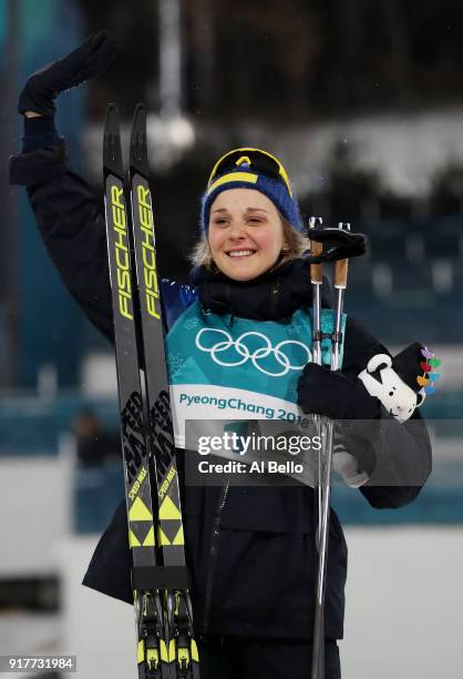 Gold medalist Stina Nilsson of Sweden celebrates during the victory ceremony for the Cross-Country Ladies' Sprint Classic Final on day four of the...