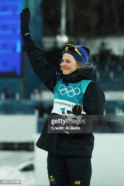 Gold medalist Stina Nilsson of Sweden celebrates during the victory ceremony for the Cross-Country Ladies' Sprint Classic Final on day four of the...