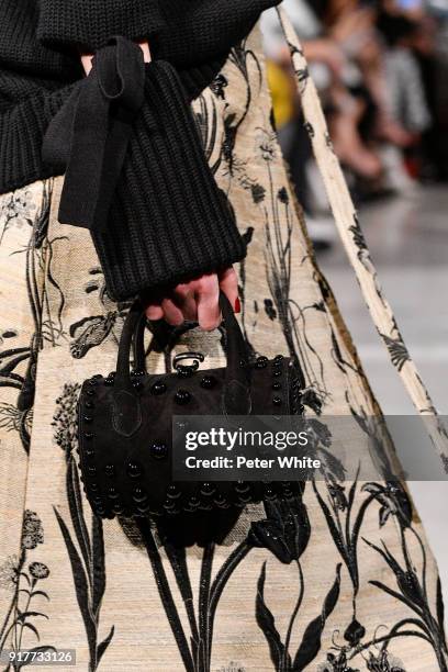 Model, bag detail, walks the runway at Oscar De La Renta fashion show during February 2018 New York Fashion Week at The Cunard Building on February...