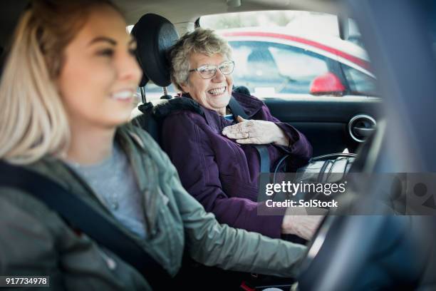 in the car with grandma - car young and old person stock pictures, royalty-free photos & images