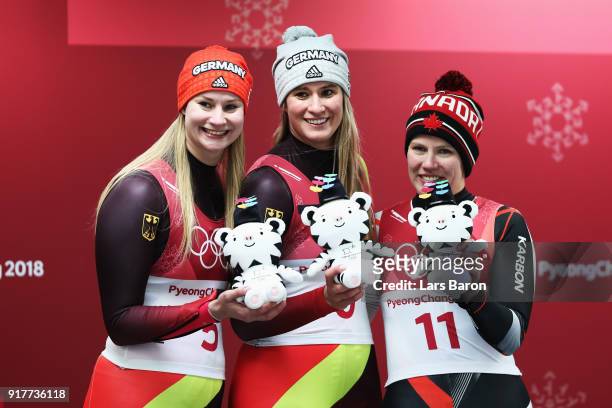Silver medalist Dajana Eitberger of Germany, gold medalist Natalie Geisenberger of Germany and bronze medalist Alex Gough of Canada celebrate...