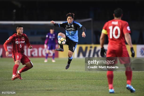 Yoshito Okubo of Kawasaki Frontale controls the ball under pressure of Cai Huikang of Shanghai SIPG during the AFC Champions League Group F match...