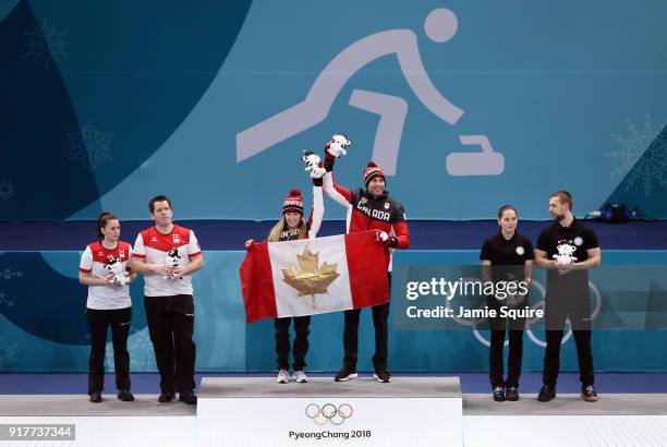 Silver medal winners Jenny Perret and Martin Rios of Switzerland, Gold medal winners Kaitlyn Lawes and John Morris of Canada, and Anastasia...