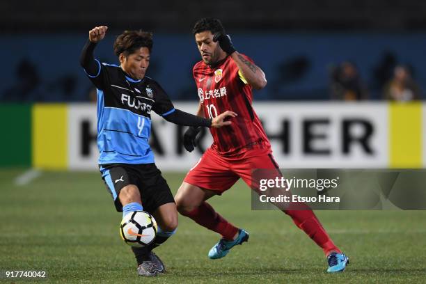 Yoshito Okubo of Kawasaki Frontale and Hulk of Shanghai SIPG compete for the ball during the AFC Champions League Group F match between Kawasaki...