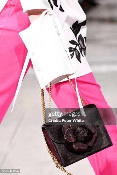 Model, bag detail, walks the runway at Oscar De La Renta fashion show during February 2018 New York Fashion Week at The Cunard Building on February...