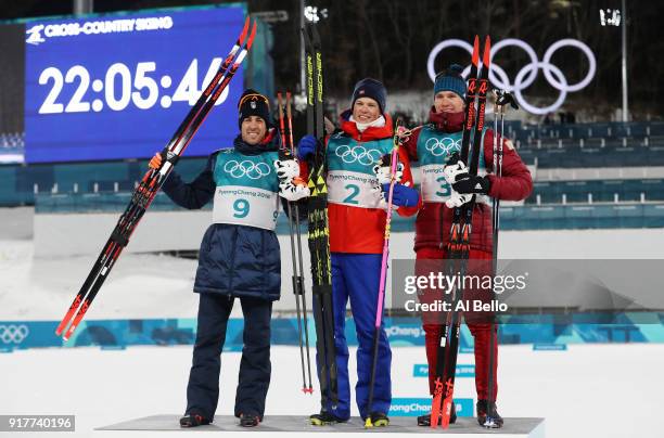 Silver medalist Federico Pellegrino, gold medalist Johannes Hoesflot Klaebo of Norway and bronze medalist Alexander Bolshunov of Olympic Athlete from...