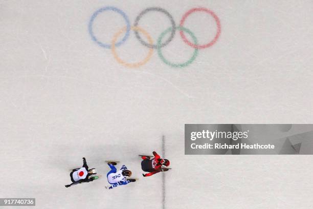 Samuel Girard of Canada, Semen Elistratov of Olympic Athlete from Russia and Keita Watanabe of Japan compete during the Men's 1000m Short Track Speed...