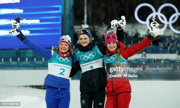 Silver medalist Maiken Caspersen Falla of Norway, gold medalist Stina Nilsson of Sweden and bronze medalist Yulia Belorukova of Olympic Athlete from...