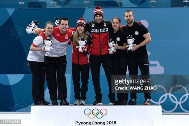 Switzerland's silver medallists Jenny Perret and Martin Rios, Canada's gold medallists Kaitlyn Lawes and John Morris and Russia's bronze medallists...