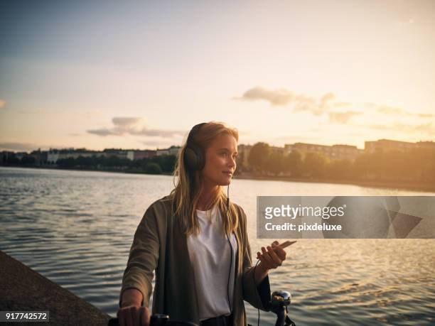 music and this scenery is all she needs - listening stock pictures, royalty-free photos & images