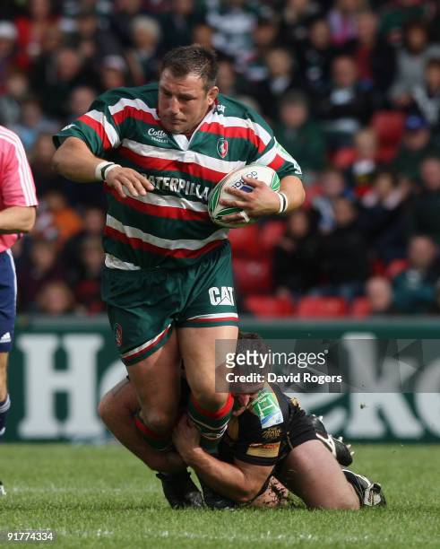 Julian White of Leicester is tackled by Huw Bennett during the Heineken Cup match between Leicester Tigers and Ospreys at Welford Road on October 11,...