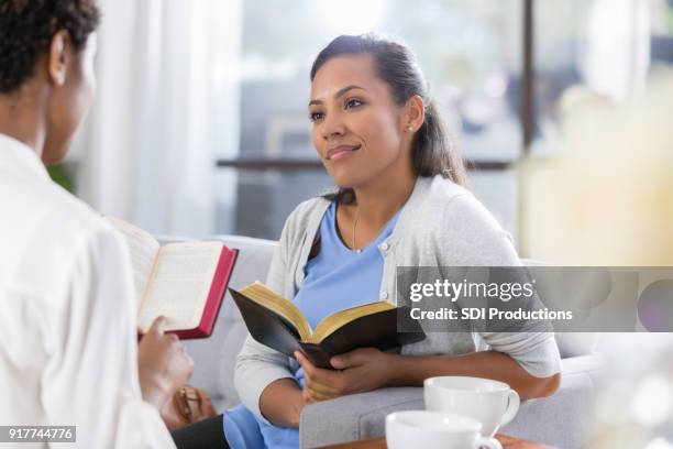 confident woman discuss bible together - black women in the bible stock pictures, royalty-free photos & images