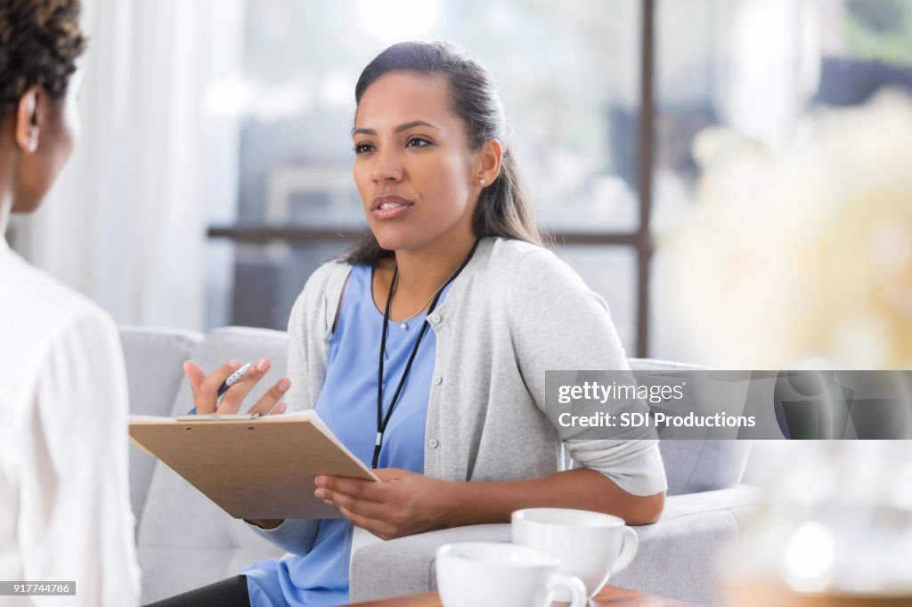 Female psychiatrist discusses something with female patient