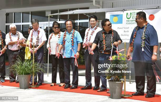 Palau President Tommy Remengesau and Mitsuyuki Unno , executive director of Nippon Foundation, attend a handover ceremony at Palau's Bureau of...