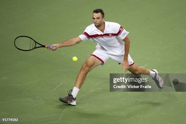 Ivo Karlovic of Croatia returns a shot to James Blake of USA during day two of 2009 Shanghai ATP Masters 1000 at the Qi Zhong Tennis Centre in...