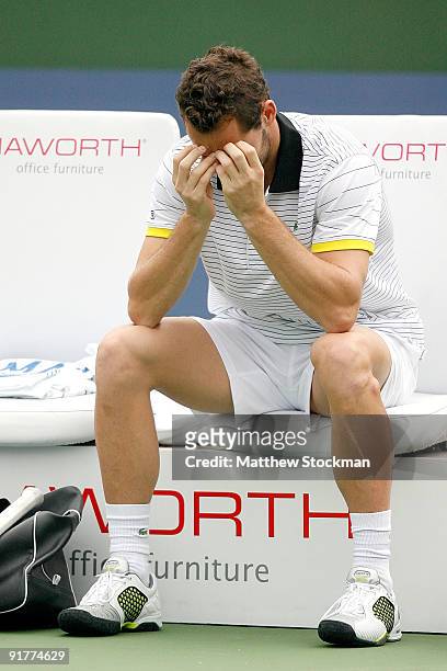 Michael Llodra of France cools down between games against Tommy Robredo of Spain during day two of the 2009 Shanghai ATP Masters 1000 at Qi Zhong...