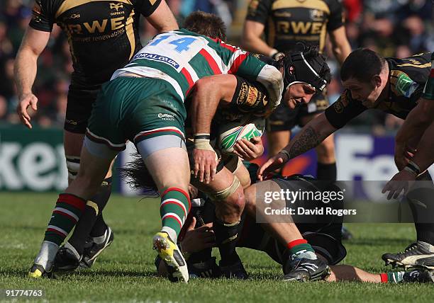 Marty Holah of the Ospreys is tackled by Johne Murphy during the Heineken Cup match between Leicester Tigers and Ospreys at Welford Road on October...