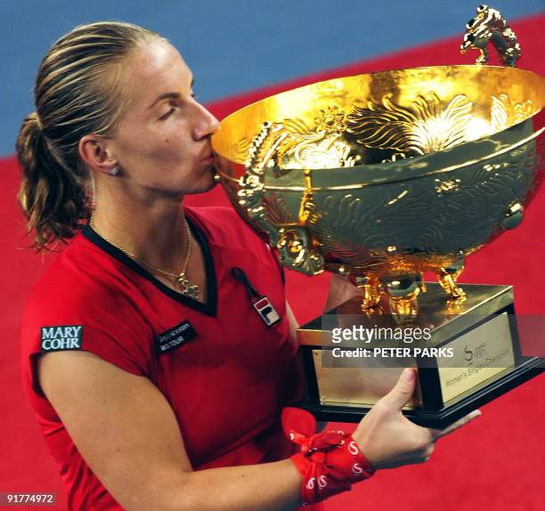 Svetlana Kuznetsova of Russia kisses the trophy during the award ceremony after beating Agnieszka Radwanska of Poland at the women's final match of...