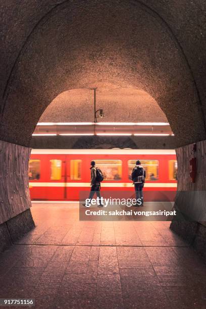two men at subway station, nuremberg city, germany - underground train stock pictures, royalty-free photos & images