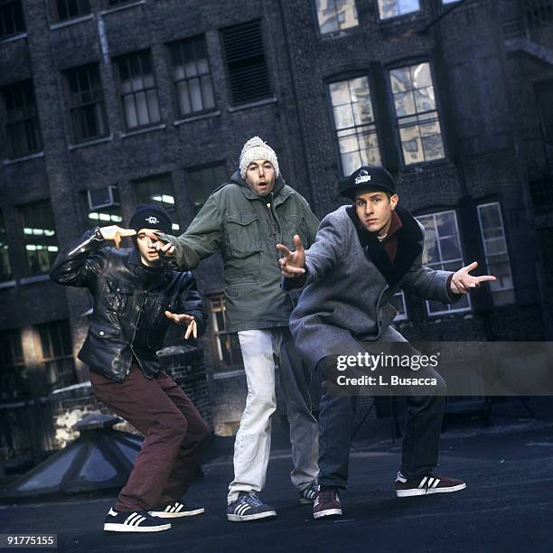 From left, American rappers Ad-Rock , MCA , and Mike D , of the group the Beastie Boys, pose on a rooftop, New York, New York, 1994.