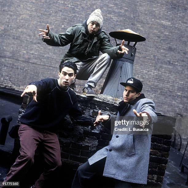 From left, American rappers Ad-Rock , MCA and Mike D , of the group the Beastie Boys, pose on a rooftop, New York, New York, 1994.