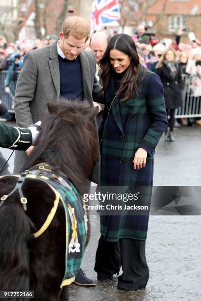 Prince Harry and Meghan Markle greet a pony as they arrive to Edinburgh Castle on February 13, 2018 in Edinburgh, Scotland.