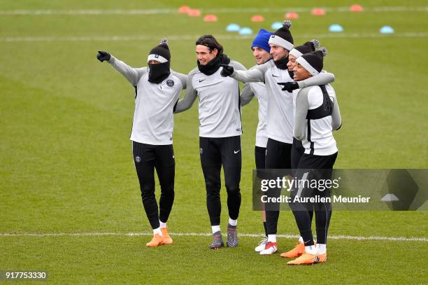 Neymar Jr, Edinson Cavani, Thomas Meunier, Adrien Rabiot, Kylian Mbappe and Christopher Nkunku react during a Paris Saint-Germain training session...