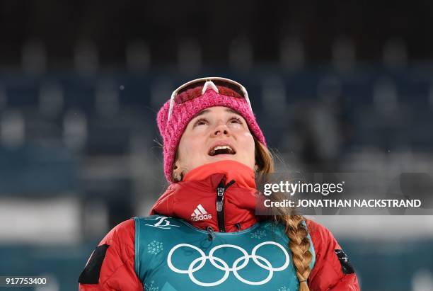 Bronze medallist Russia's Yulia Belorukova reacts on the podium during the victory ceremony in the women's cross-country individual sprint classic...