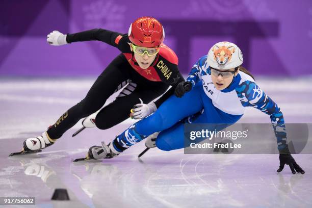 Kexin Fan of China and Sofia Prosvirnova of Olympic Athlete from Russia compete during the Ladies' 500m Short Track Speed Skating quarterfinal on day...