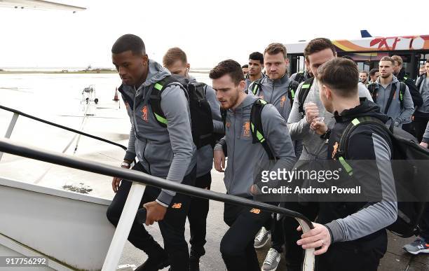 Georginio Wijnaldum and Andrew Robertson of Liverpool board the plane for their trip to Porto at Liverpool John Lennon Airport on February 13, 2018...