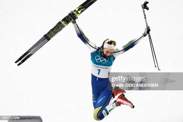 Gold medalist Sweden's Stina Nilsson reacts on the podium during the victory ceremony in the women's cross-country individual sprint classic final at...