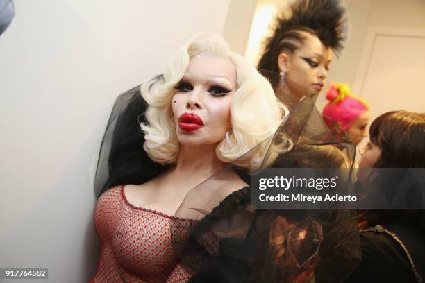 Model Amanda Lepore poses backstage during the Kaimin fashion show at the Glass Houses on February 12, 2018 in New York City.