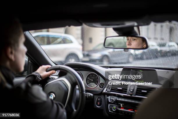 Posed scene of a woman who reserves into a parking space on February 13, 2018 in Berlin, Germany.