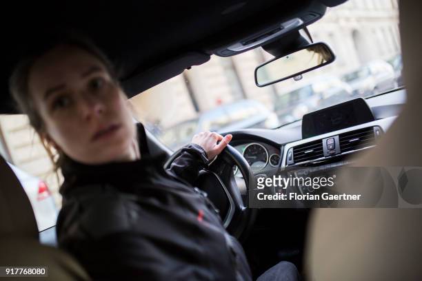 Posed scene of a woman who reserves into a parking space on February 13, 2018 in Berlin, Germany.