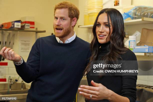 Britain's Prince Harry and his fiancée US actress Meghan Markle visit Social Bite, a business and cafe, during a visit to Scotland on February 13,...