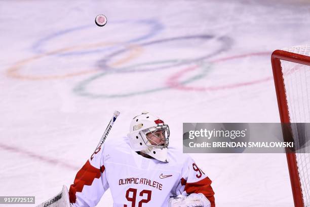 Russia's Nadezda Morozova looks for the puck after blocking a shot in the women's preliminary round ice hockey match between the US and Olympic...