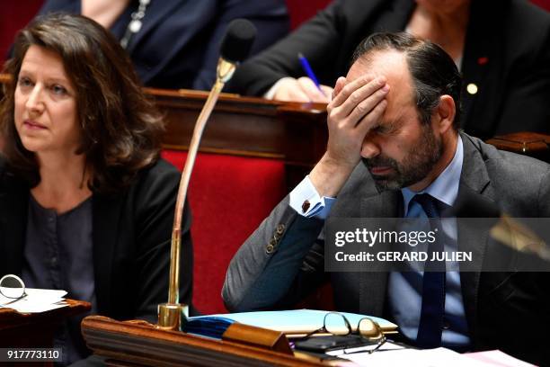 French Prime Minister Edouard Philippe reacts during a session of questions to the government, on February 13, 2018 at the French National Assembly...