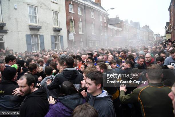 Rival teams 'Up'ards' and 'Down'ards' battle for the ball in the streets during the Royal Shrovetide Football match in Ashbourne, Derbyshire, England...