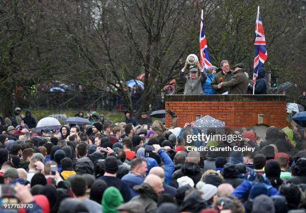 The Shrovetide Ball is held aloft at the start of the match as Rival teams 'Up'ards' and 'Down'ards' battle for the best position to receive it...