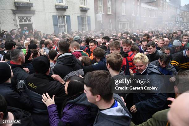 Rival teams 'Up'ards' and 'Down'ards' battle for the ball during the Royal Shrovetide Football match in Ashbourne, Derbyshire, England on February...