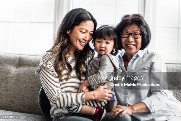 portrait of 3 generations of women at home - multi generation family stock pictures, royalty-free photos & images