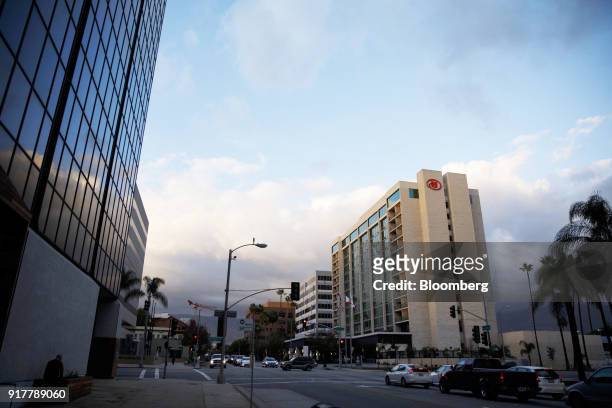 Vehicles pass in front of the Hilton Pasadena hotel in Pasadena, California, U.S., on Monday, Feb. 12, 2018. Hilton Worldwide Holdings Inc. Is...
