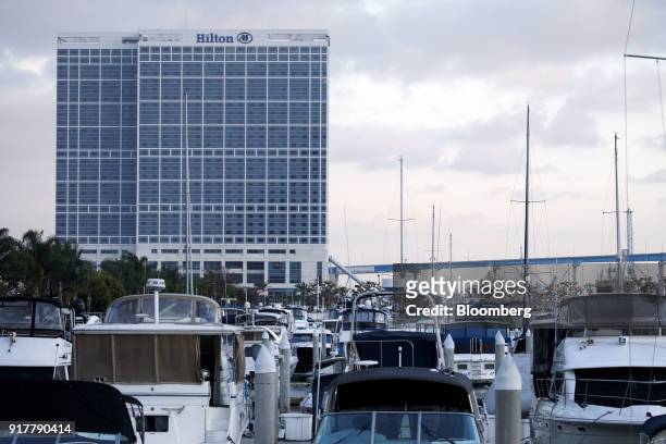 Boats sit docked near the Hilton San Diego Bayfront hotel in San Diego, California, U.S., on Saturday, Feb. 10, 2018. Hilton Worldwide Holdings Inc....