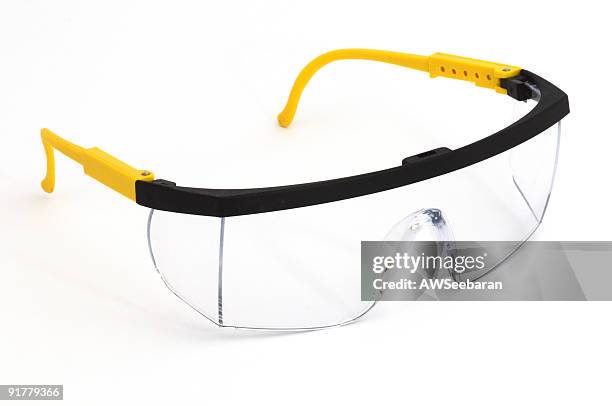 pair of safety goggles on a background - eye protection stock pictures, royalty-free photos & images